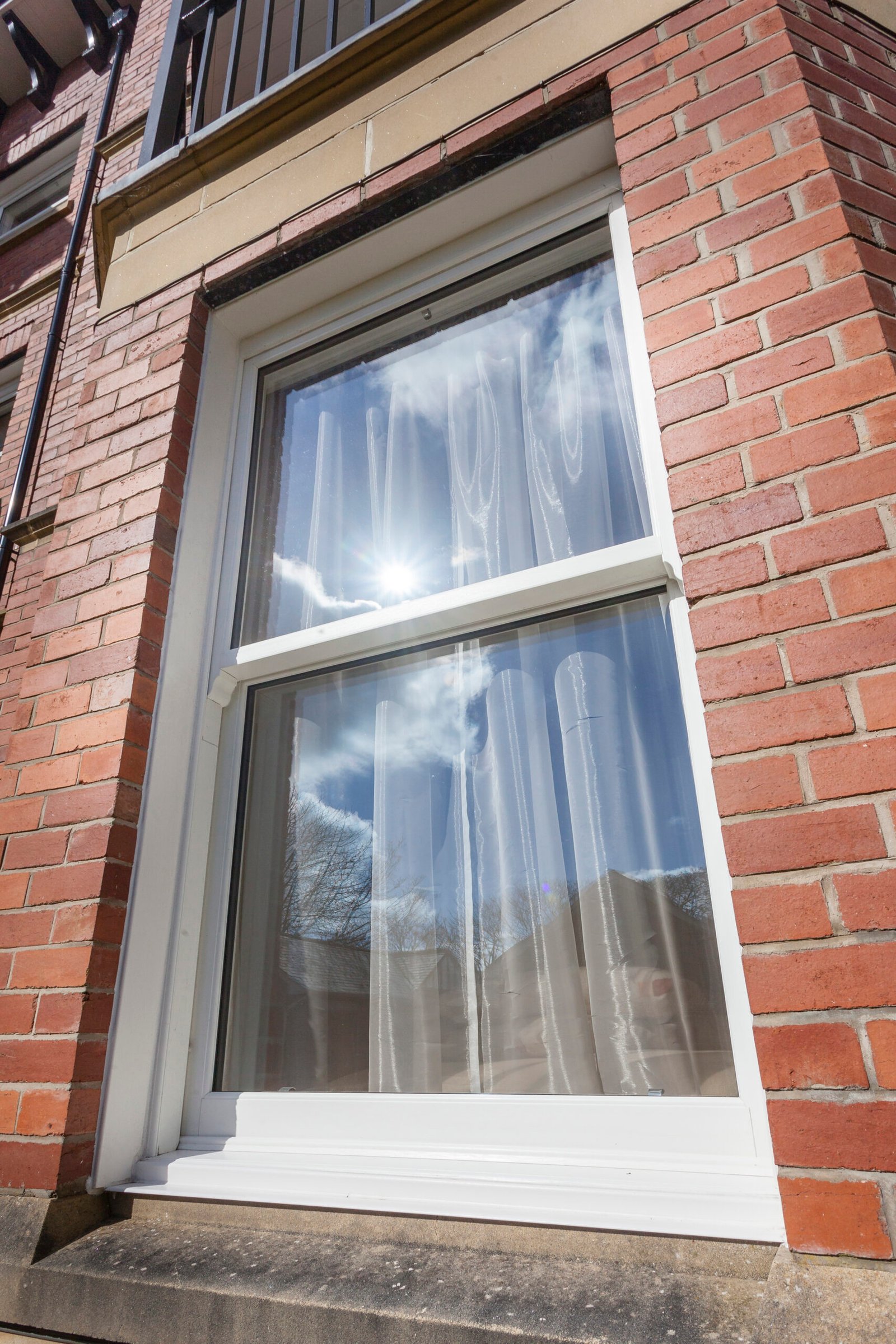 uPVC sliding sash windows on a house front.